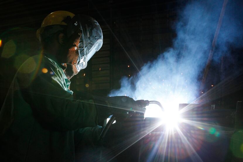 
David Allen a welder at Signal Metals Industries welds a tundish on Friday, May 2, 2014 in...