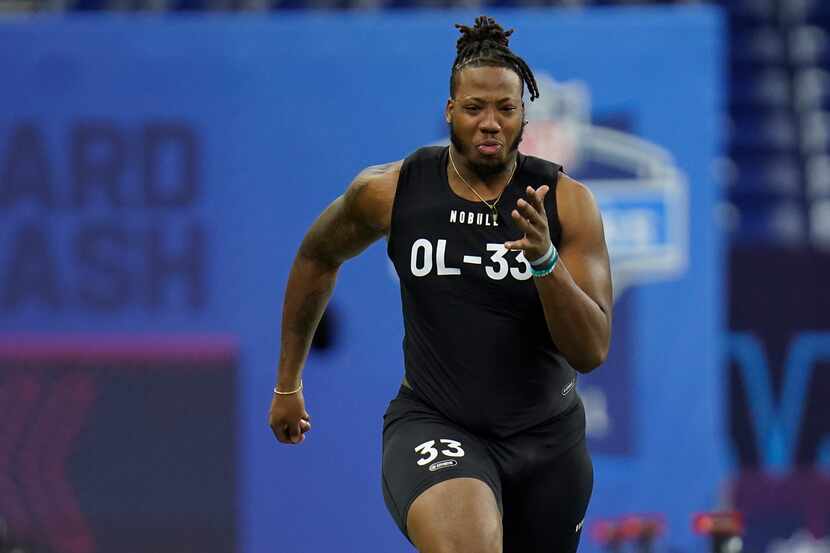 Oklahoma offensive lineman Wanya Morris runs a drill at the NFL scouting combine in...