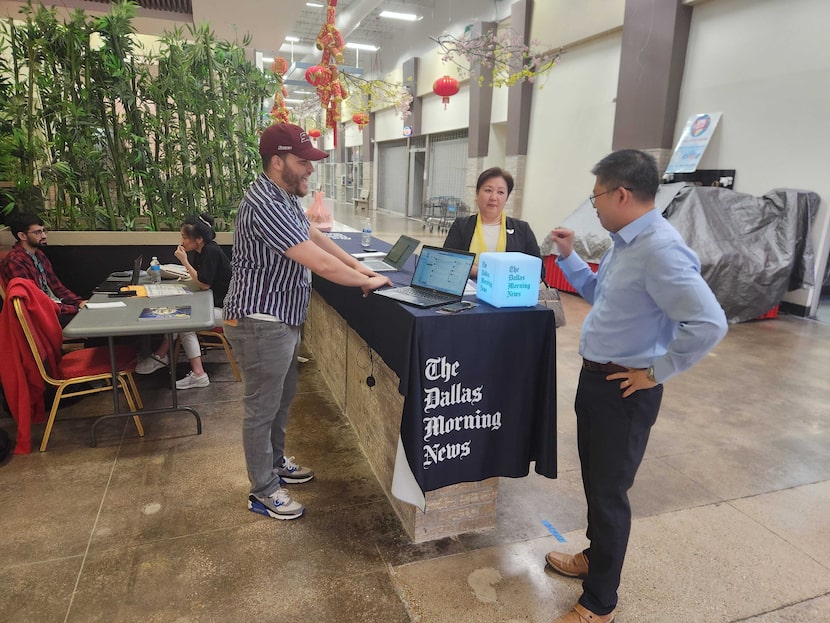 Staffers from The Dallas Morning News speak with community members at Asia Times Square in...