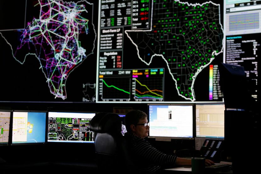 System operators work in the command center of the Electric Reliability Council of Texas in...