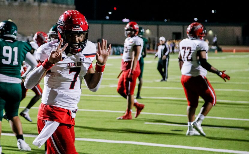 Cedar Hill senior quarterback Kaidon Salter (7) flashes his number “7” in celebration of...