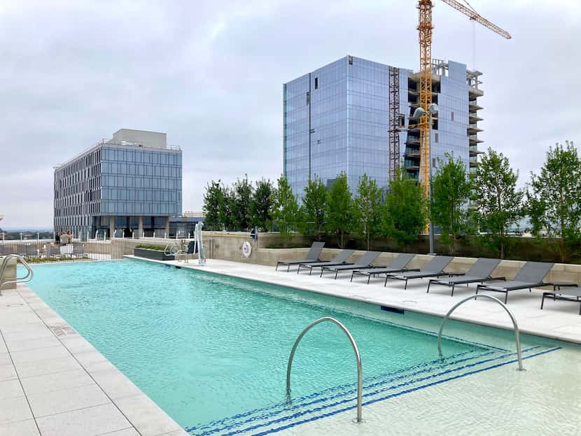 The pool deck at the new Monarch apartments at Frisco's Hall Park development. Construction...