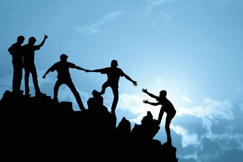 Group of people on peak mountain  climbing helping team work , success concept