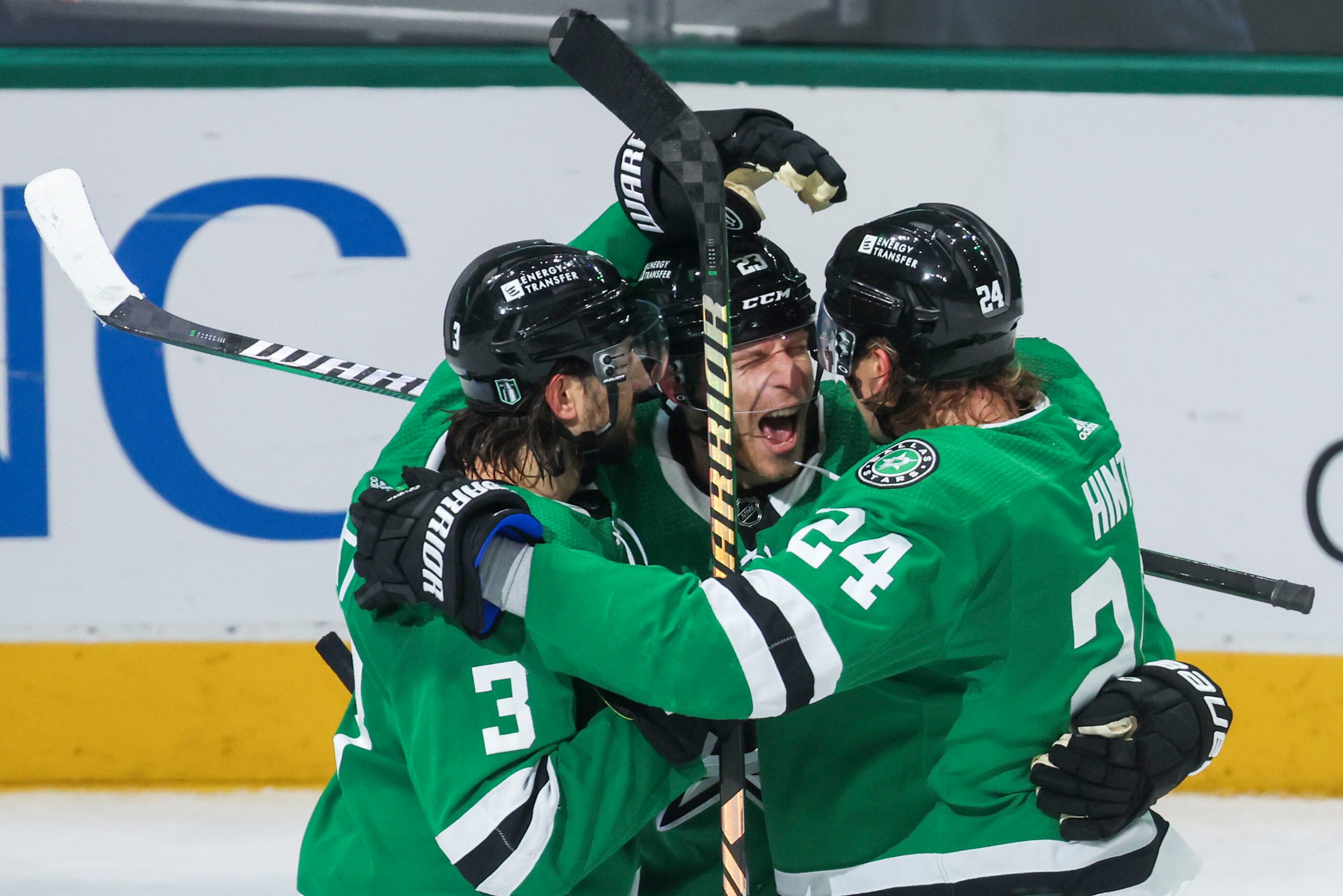 Dallas Stars defenseman Chris Tanev (left) and enter Roope Hintz (right) congratulates...