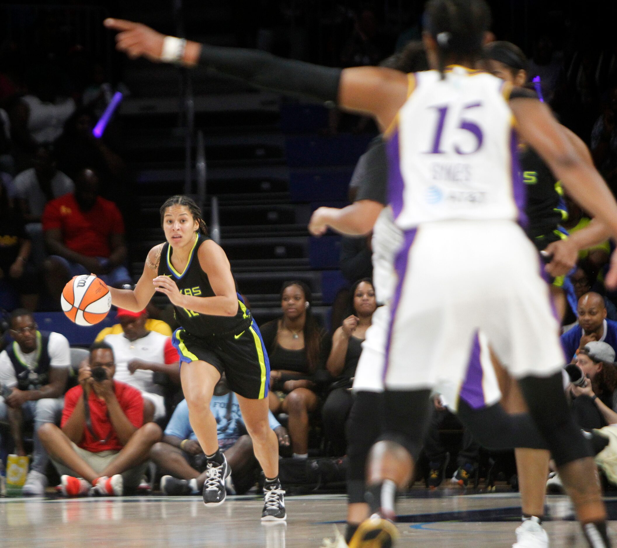 Dallas Wings guard Veronica Burton (12) brings the ball up court during the first half of...