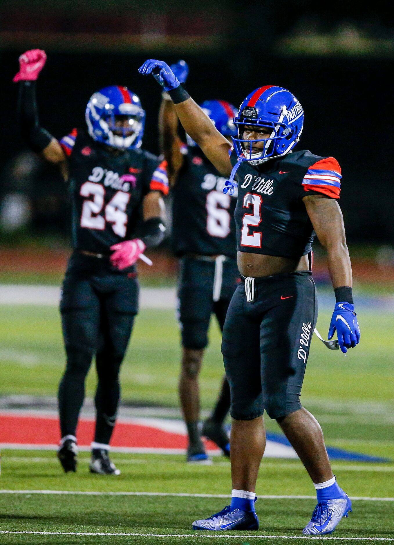 Duncanville senior linebacker Jordan Crook (2) signals to his teammates during the first...