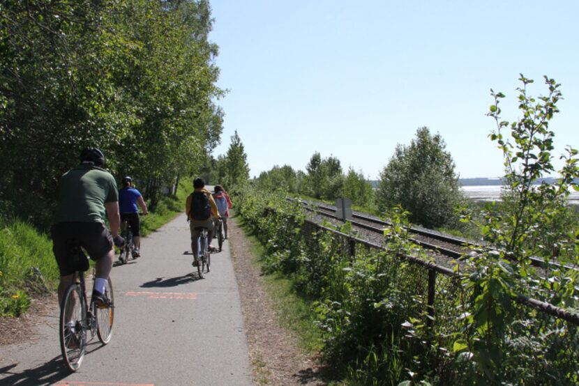 This photo taken June 11, 2013, shows people using the Tony Knowles Coastal Trail in...