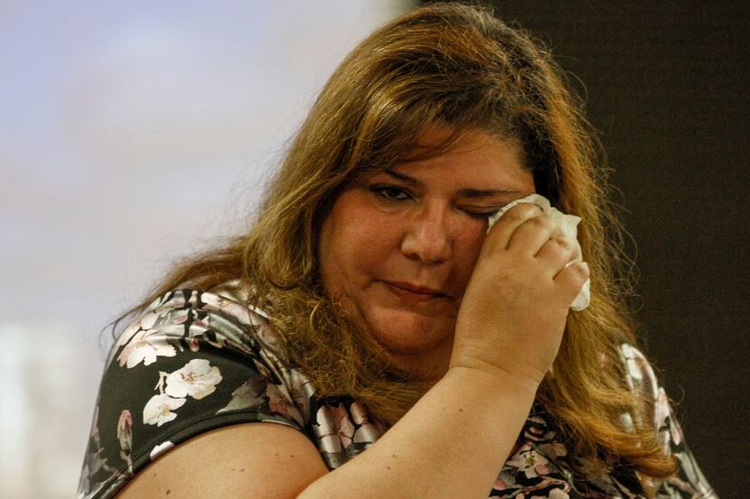 Linda Randazzo wipes away tears after speaking to the leadership group a Medical City Plano...