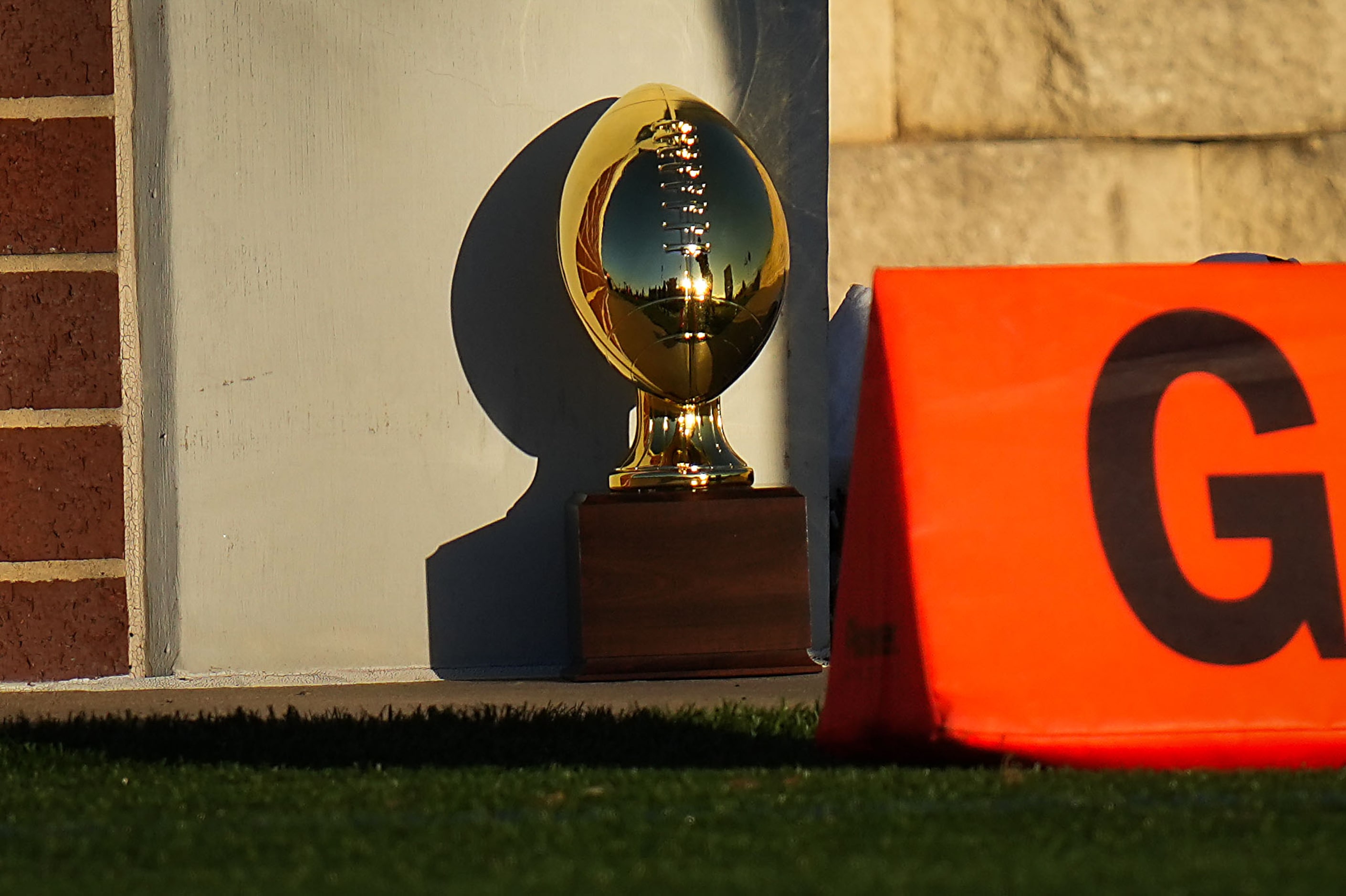 The game trophy rests near the end zone during the second half of a UIL Class 6A Division I...