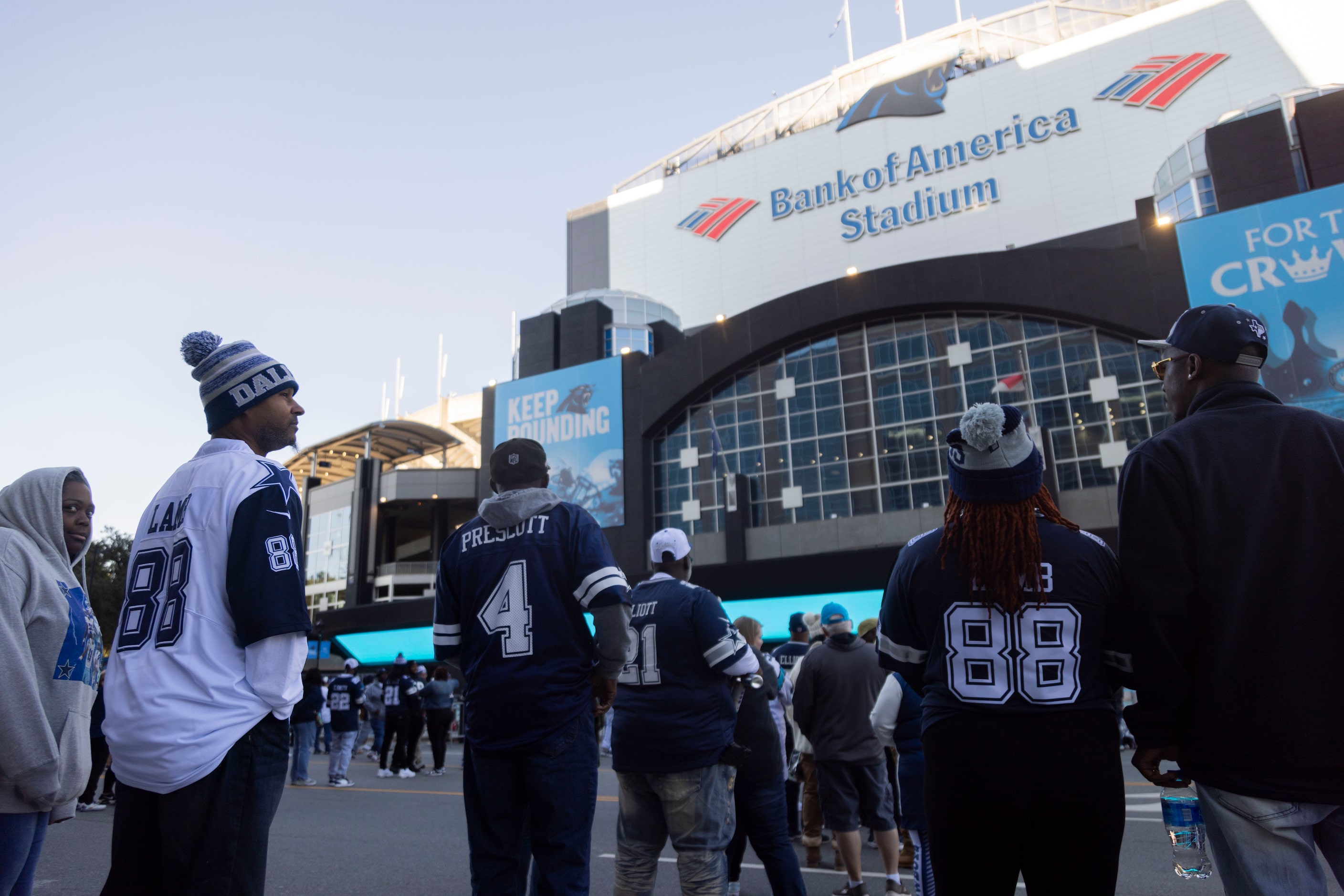 Dallas Cowboys fans wait to enter the stadium before an NFL game against the Carolina...