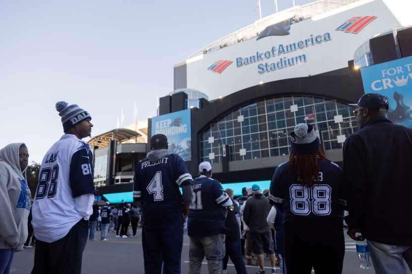 Dallas Cowboys fans wait to enter the stadium before an NFL game against the Carolina...