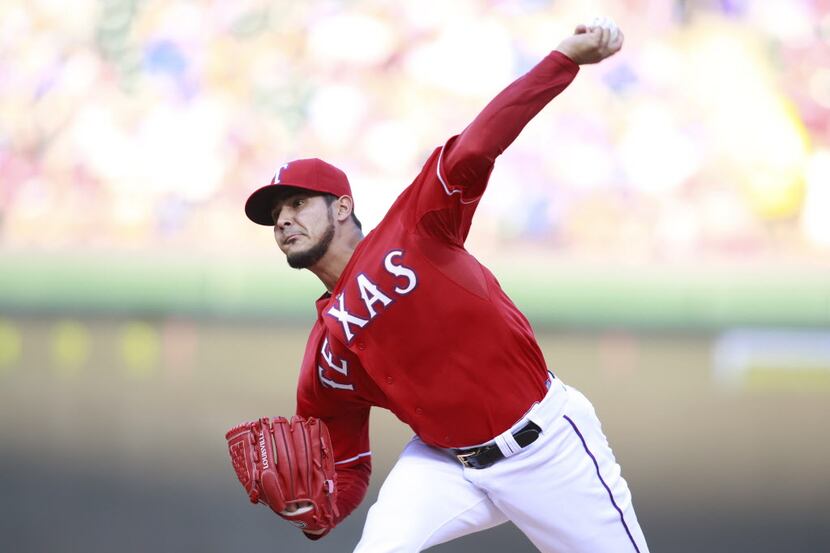 May 10, 2014; Arlington, TX, USA; Texas Rangers starting pitcher Martin Perez (33) throws...