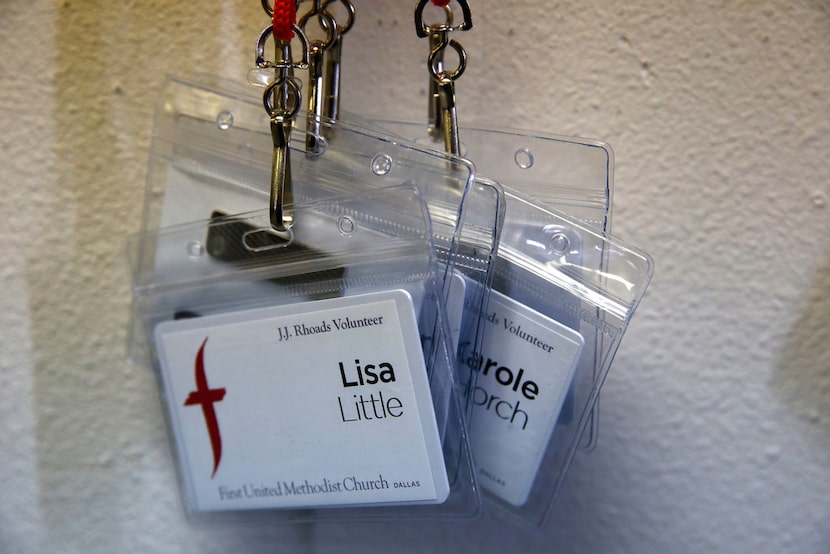 A collection of name tags hangs on the wall for FUMC Dallas volunteers at the elementary...