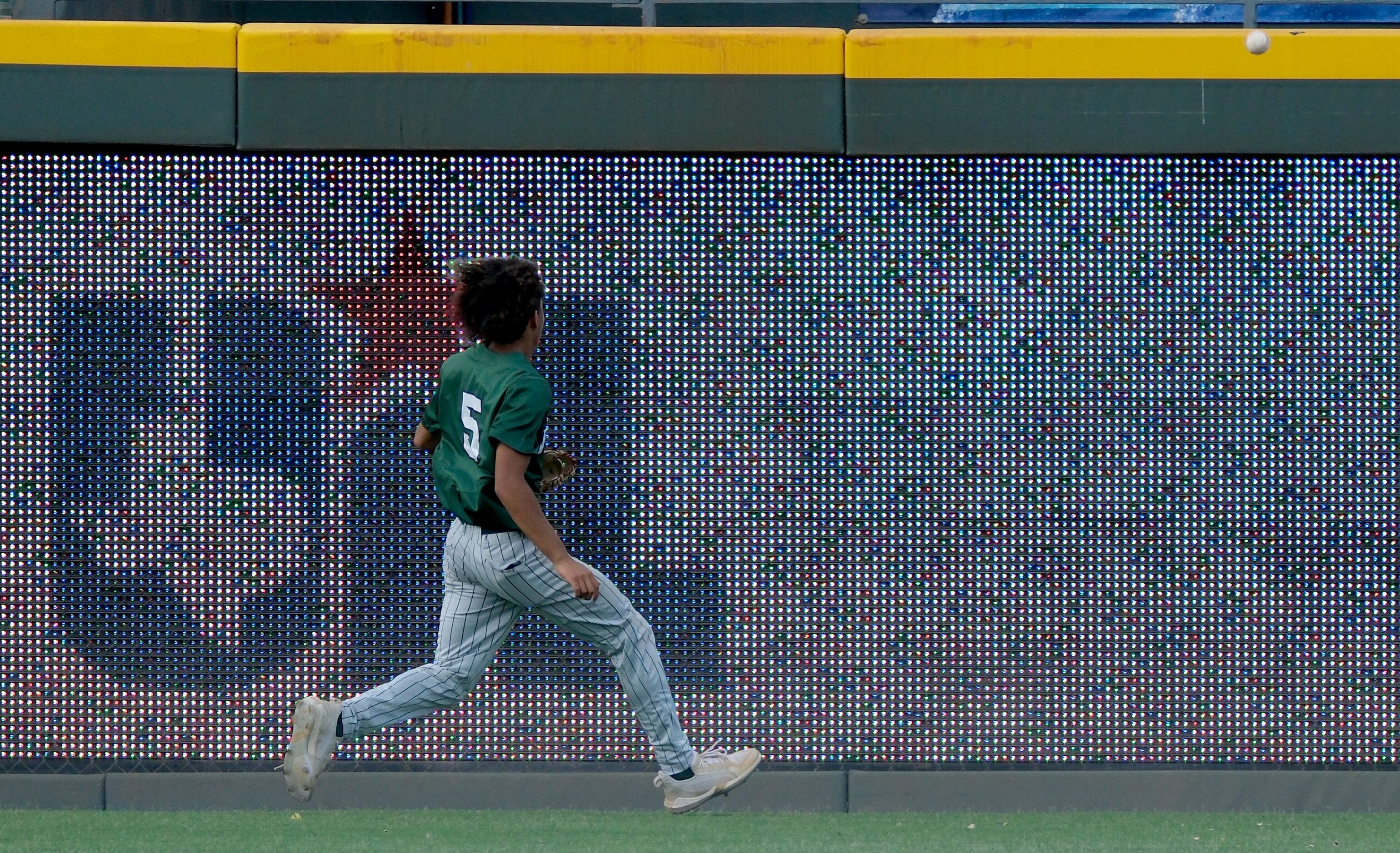 Frisco Reedy Jalen Stringfellow, (5), watches a ball hit by Magnolia West Dawson Park, (3),...