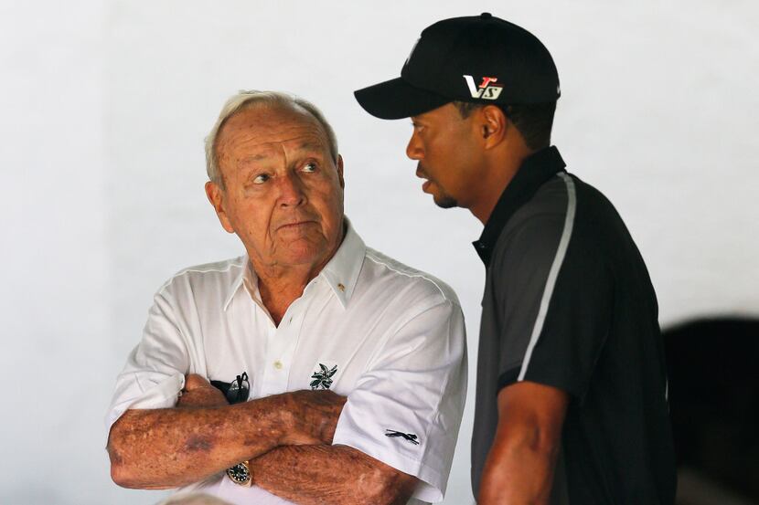 ARDMORE, PA - JUNE 11:  Tiger Woods talks with Arnold Palmer prior to his practice round...