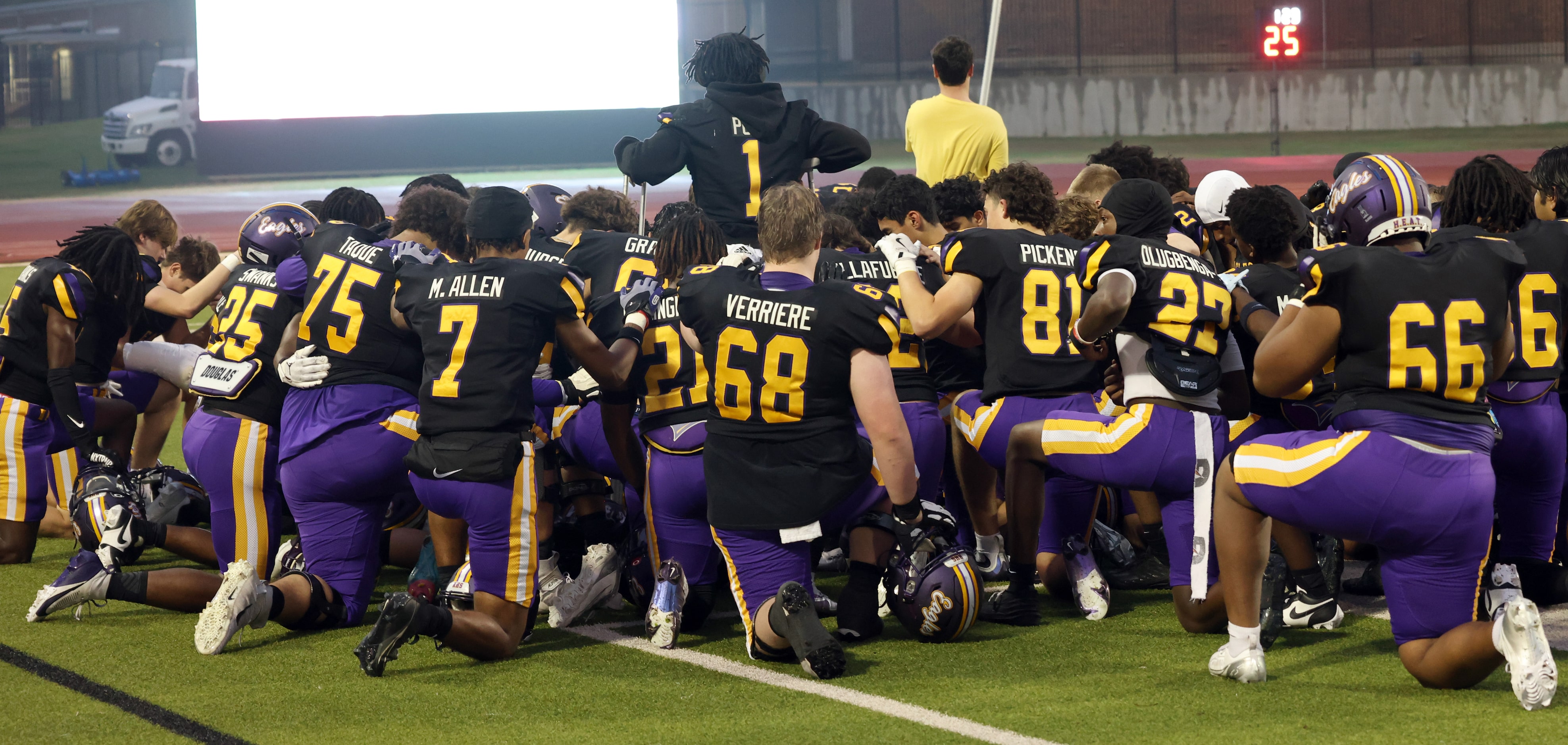 Richardson players use to pray before the start of their football game against Irving...