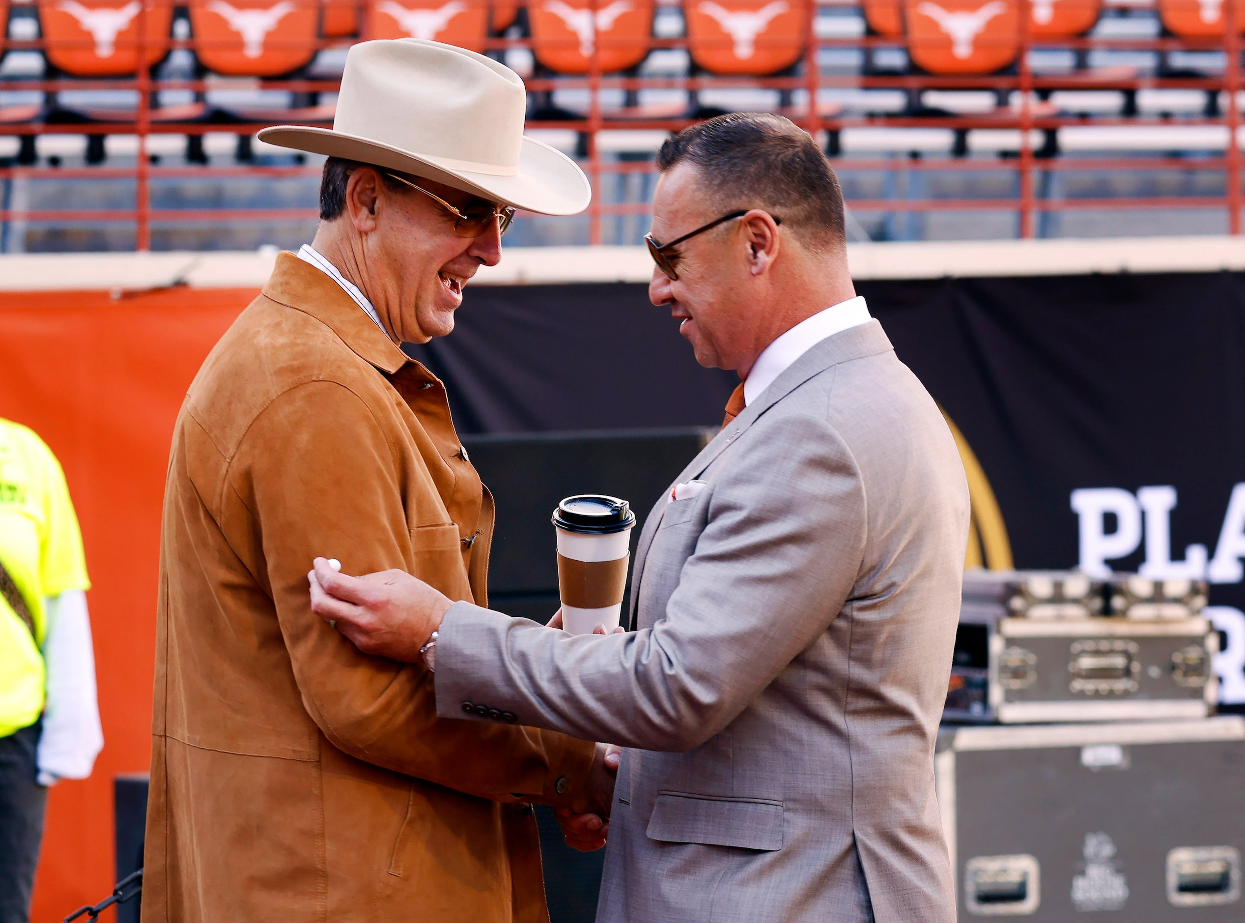 Texas Longhorns head coach Steve Sarkisian  is greeted by athletic director Chris Del Conte...