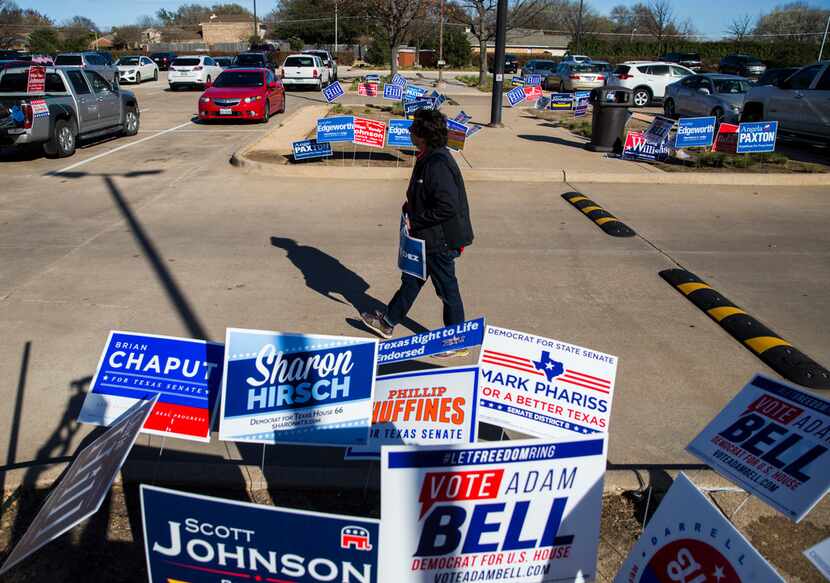 Gubernatorial candidate and former Dallas Sheriff Lupe Valdez walks among campaign signs...