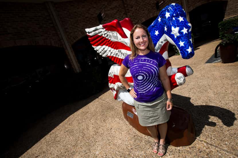 Sheri Hall poses for a portrait in front of a Pegasus sculpture at the Preston Valley...