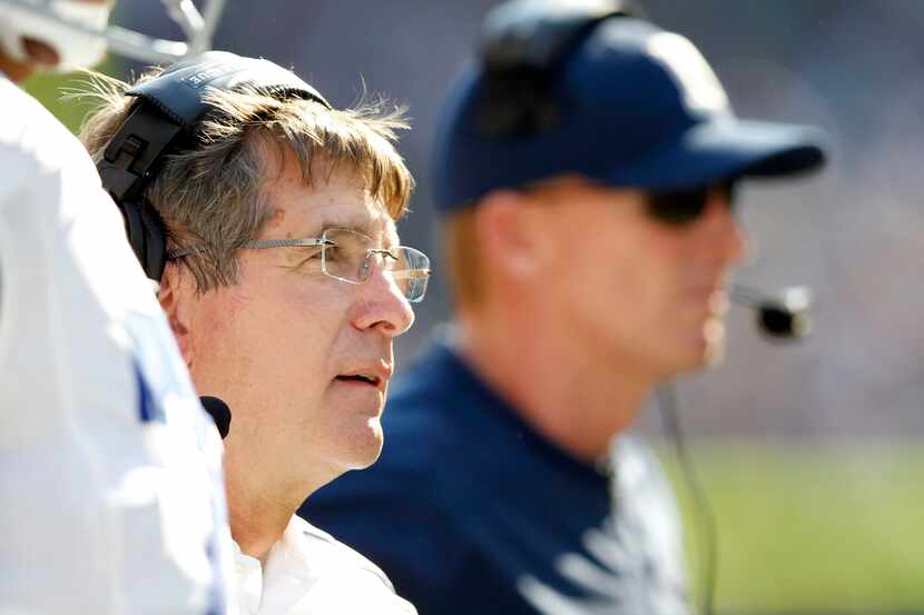 Dallas Cowboys offensive coordinator Bill Callahan watches from the sideline in a game...