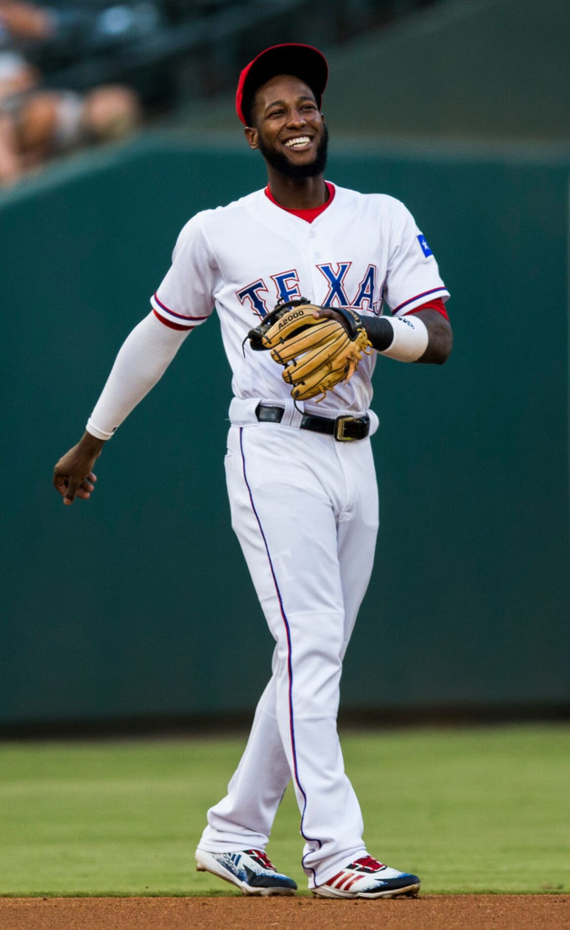 Texas Rangers shortstop Jurickson Profar (19) smiles as he waits for the first inning to...