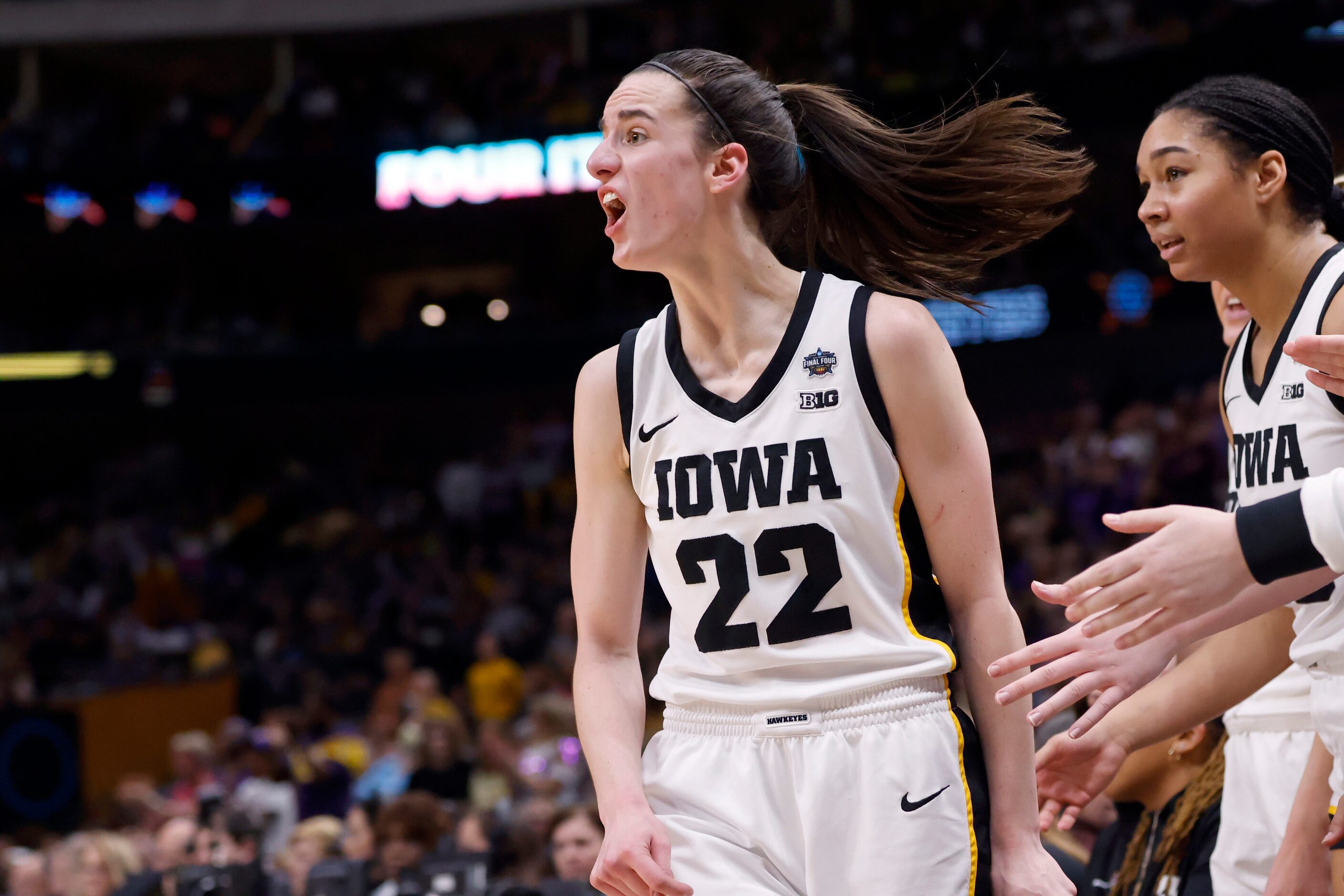 Iowa Hawkeyes guard Caitlin Clark (22) reacts after coming out of the game against the LSU...