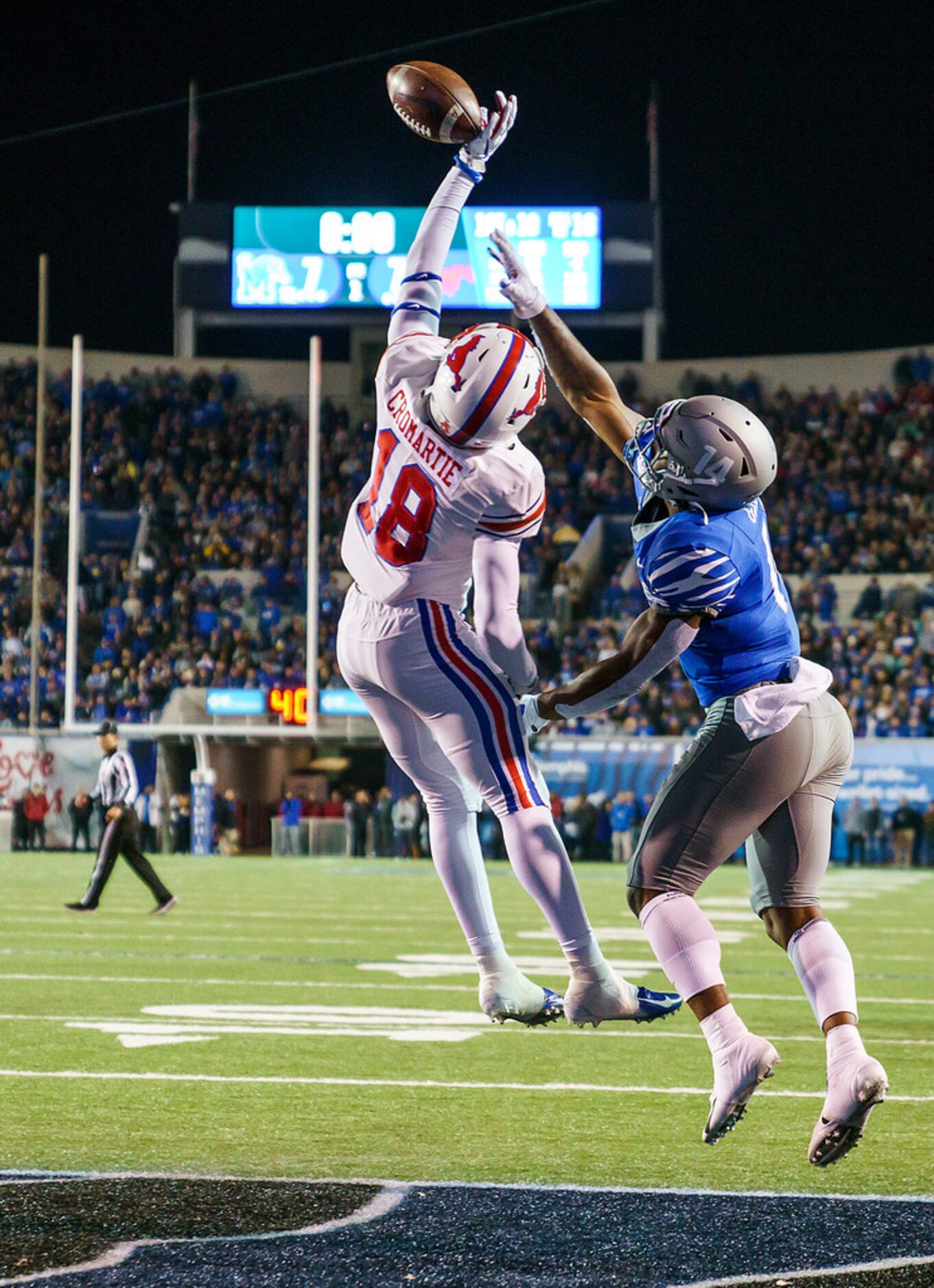 SMU safety Chace Cromartie (18) breaks up a pass in the end zone intended for Memphis wide...