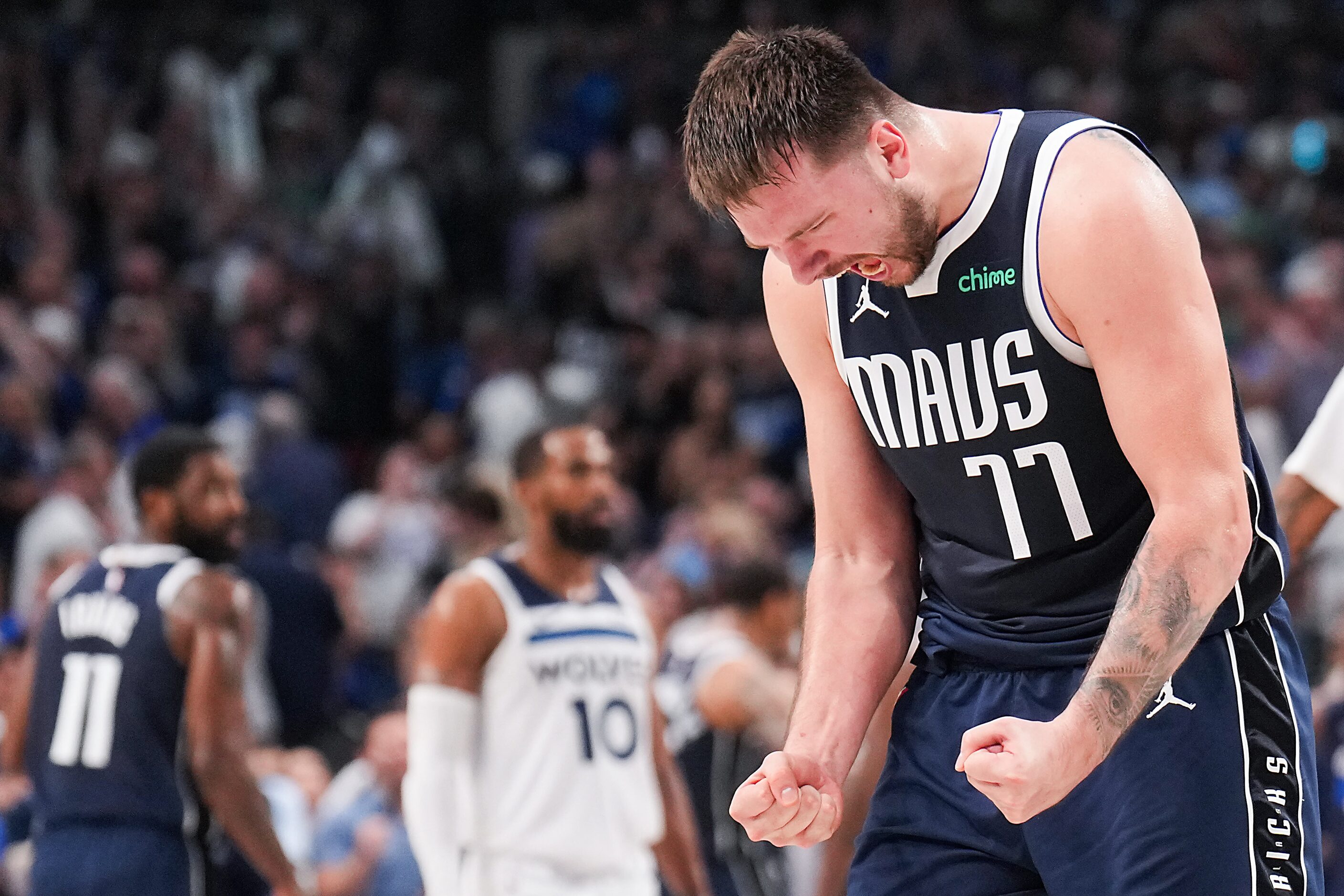 Dallas Mavericks guard Luka Doncic (77) celebrates during the final minute of a 116-107...