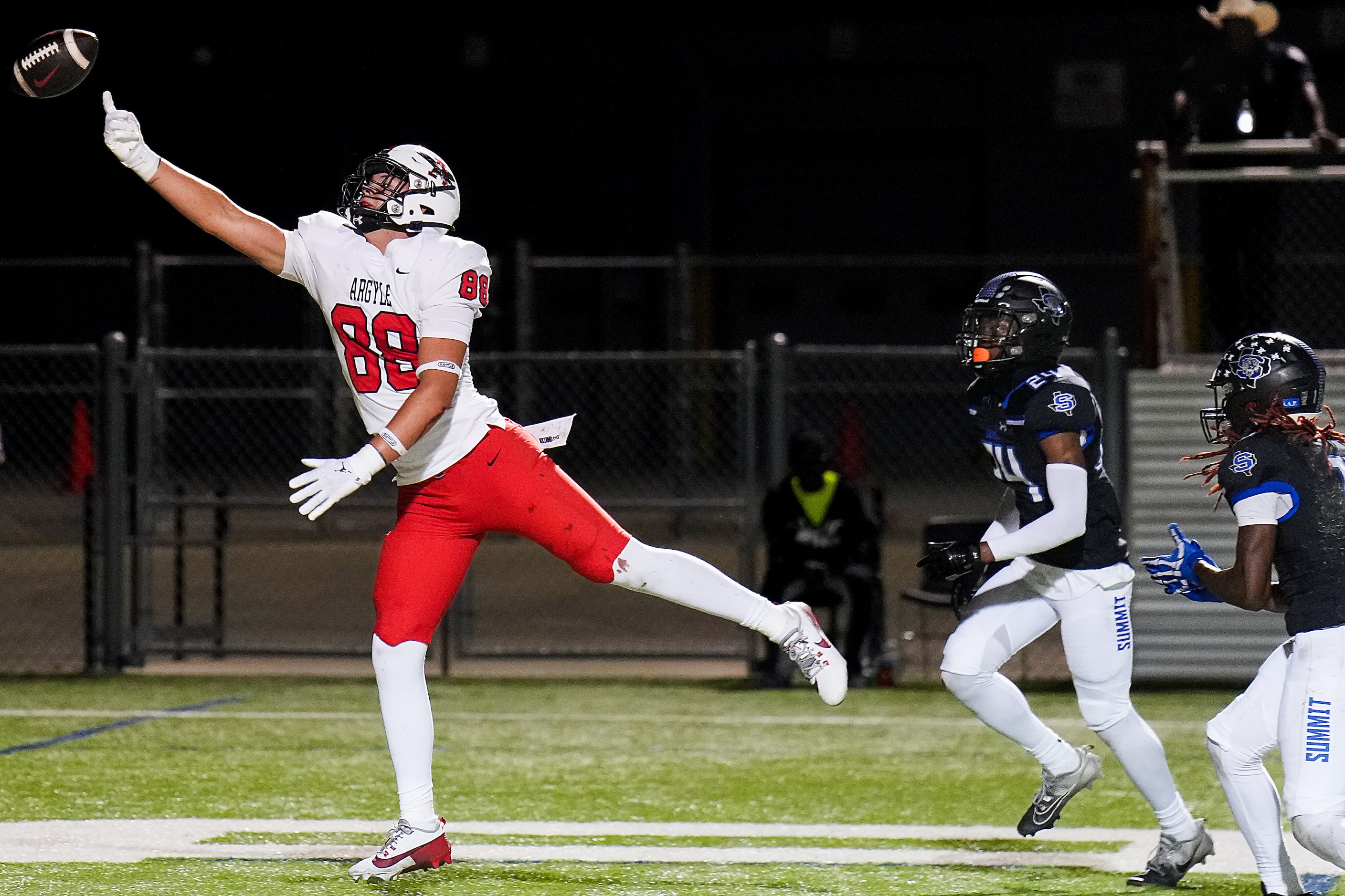 A pass in the end zone goes just out of reach for Argyle tight end Braden Bach (88) during...