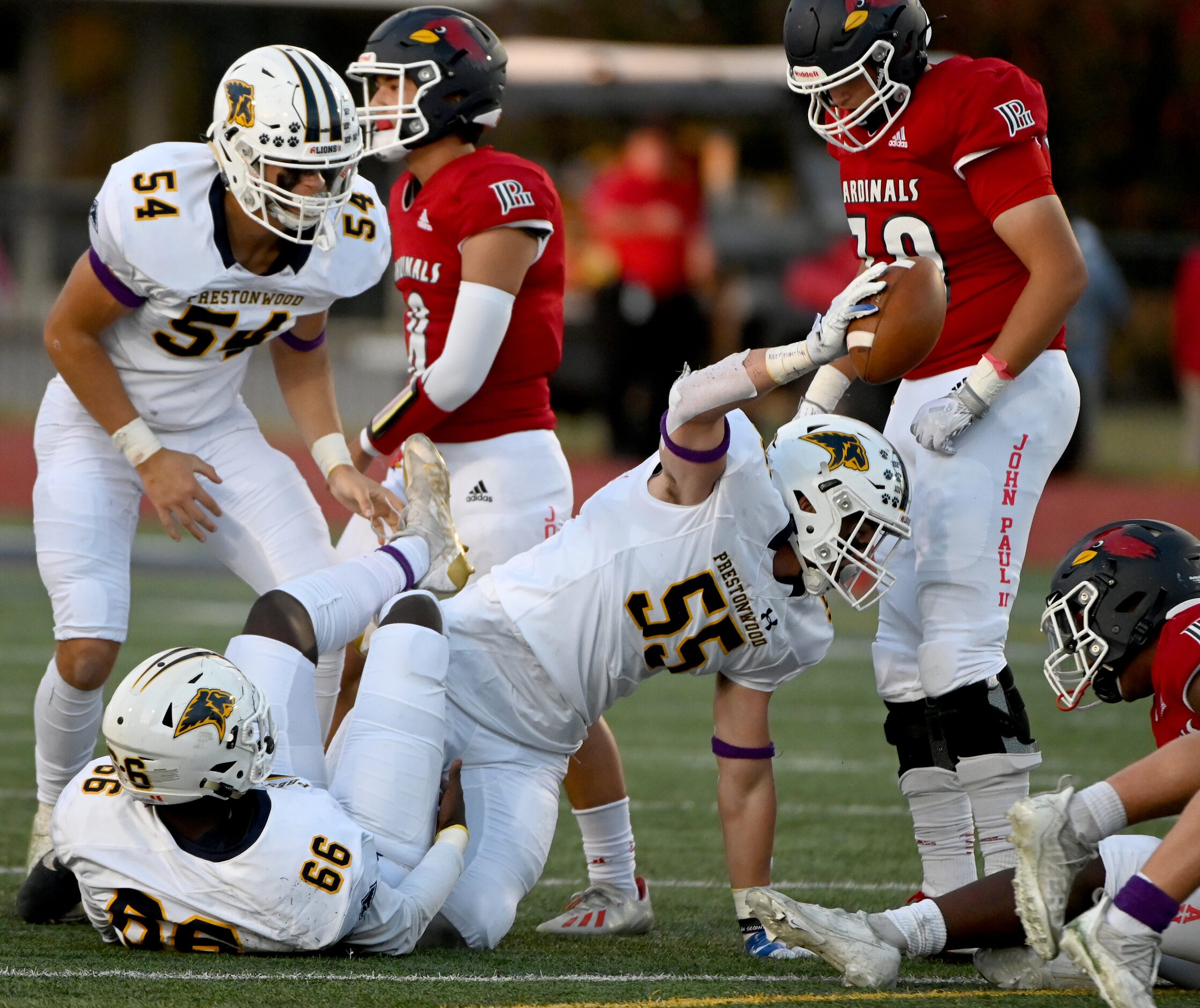 Prestonwood's Luke McGary (55) shows off his fumble recovery in the first half of a high...