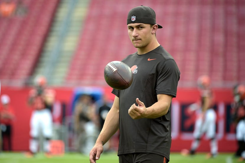 Cleveland Browns quarterback Johnny Manziel watches warmups on the field before a preseason...