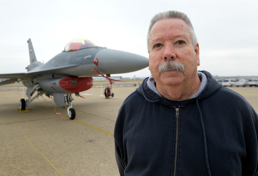 Bobby Tamplin stands next to the last F-16 to roll off the line at Lockheed Martin...