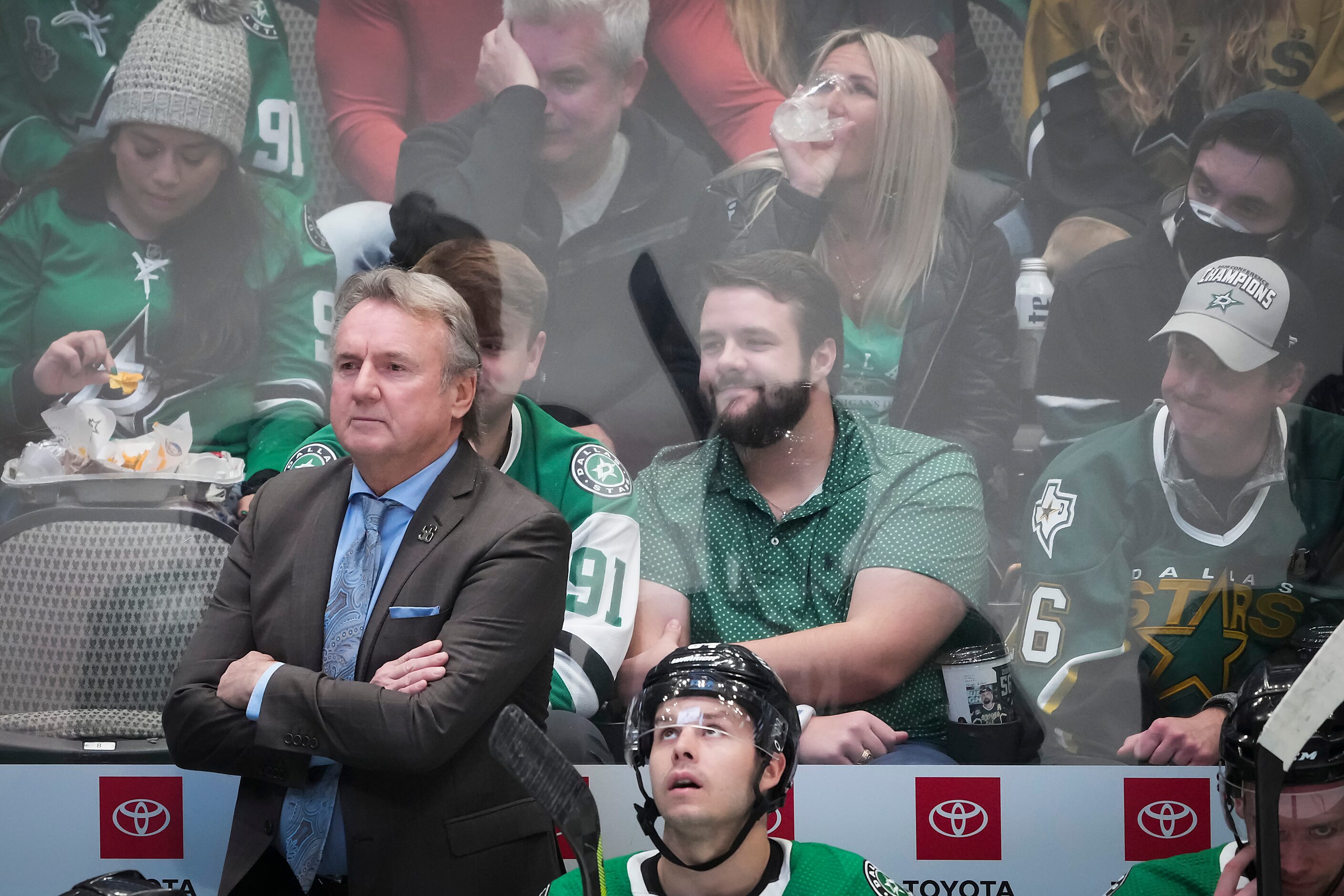 Dallas Stars coach Rick Bowness watches from the bench during the first period of an NHL...