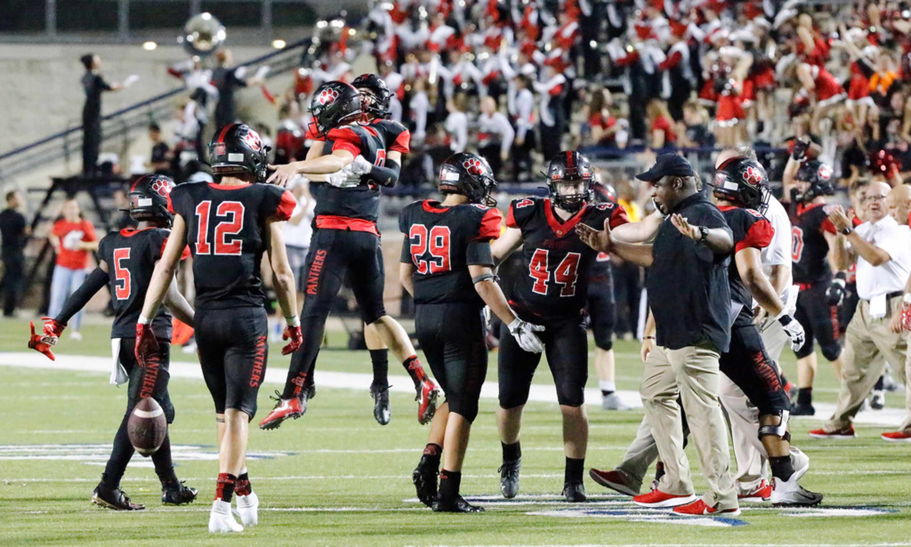 Colleyville Heritage reacts as they hang on to win by three points as Colleyville Heritage...
