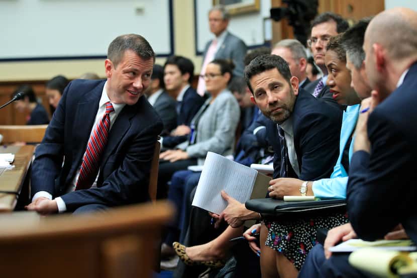 FBI Deputy Assistant Director Peter Strzok (left) confers with his legal team during a House...