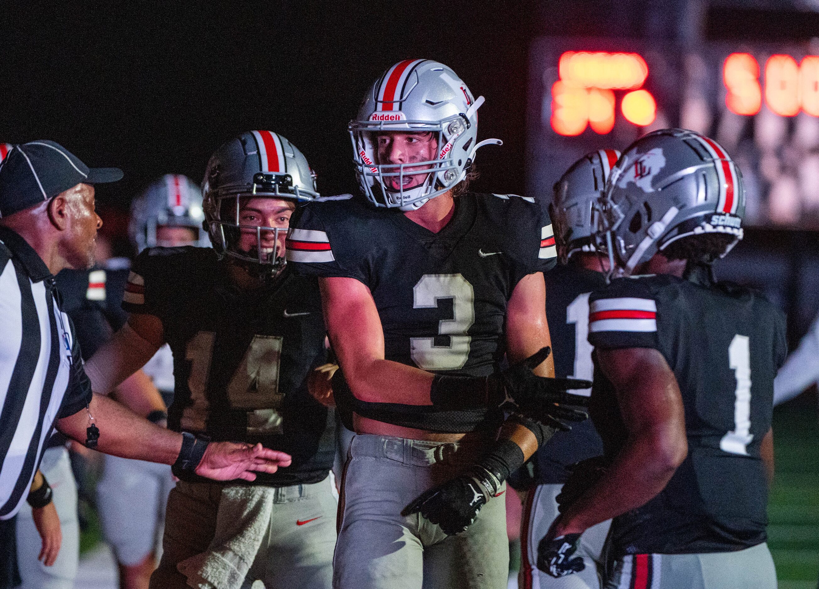 Lovejoy's wide receiver Parker Livingstone (3),  quarterback Austin Gonzalez (14) and wide...