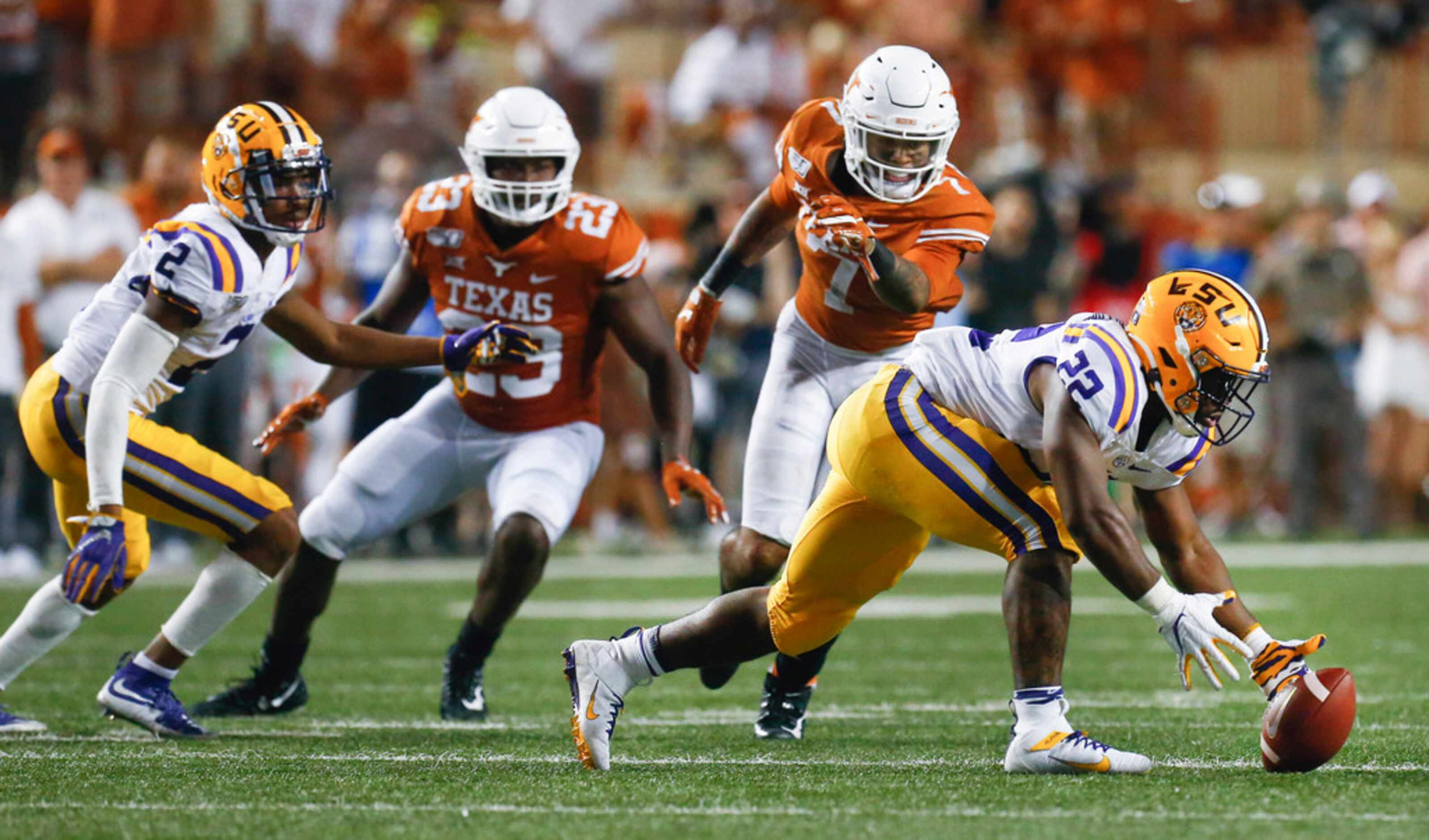 LSU Tigers running back Clyde Edwards-Helaire (22) reaches to recover a fumble during the...