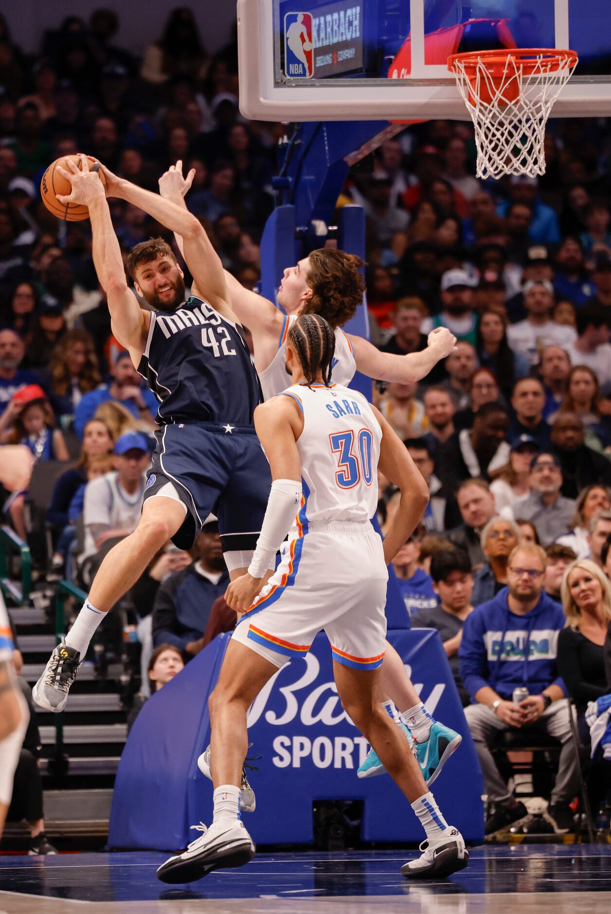 Dallas Mavericks forward Maxi Kleber (42) catches the rebound against Oklahoma City Thunder...