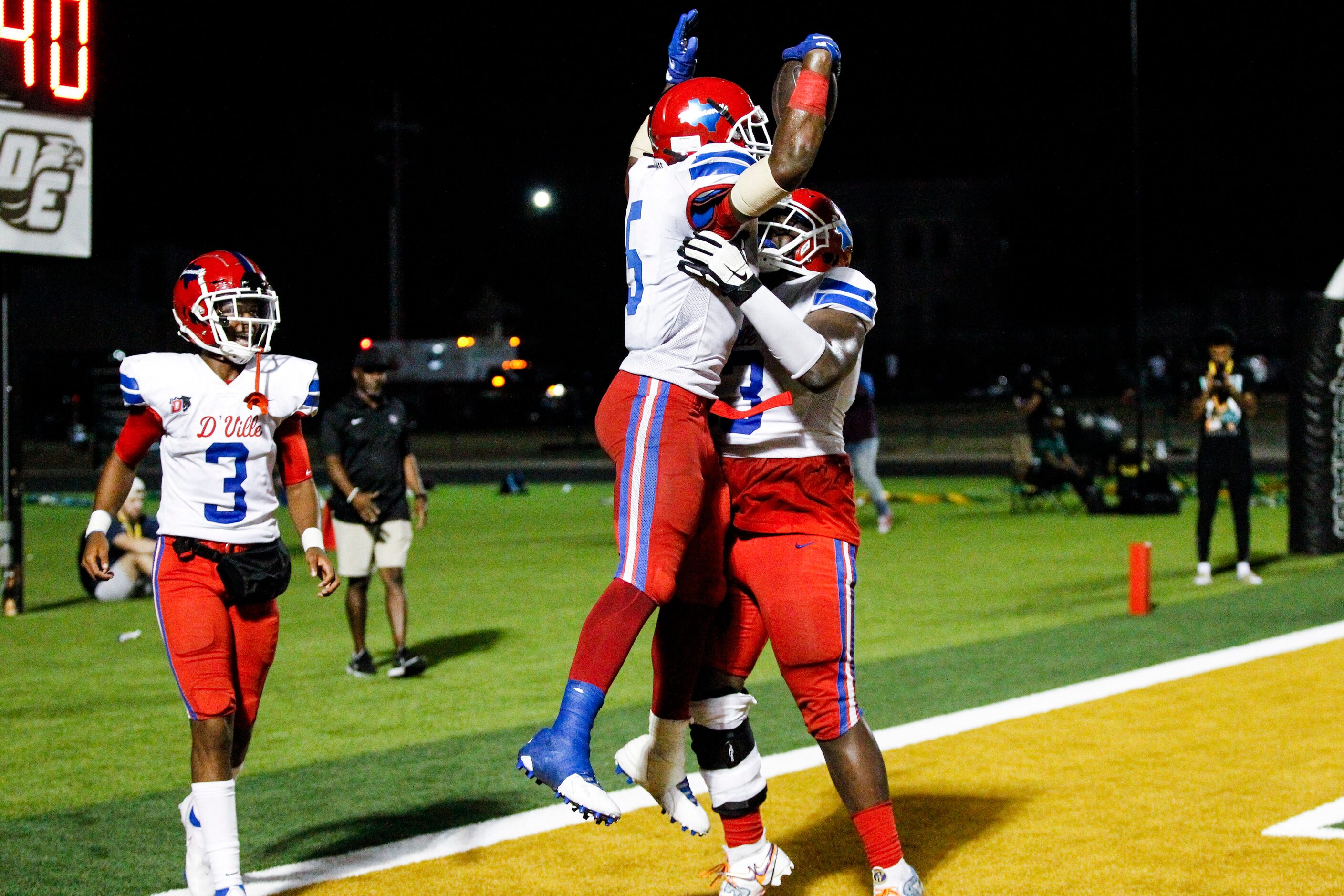 Duncanville senior running back Malachi Medlock (5) is congratulated by senior offensive...