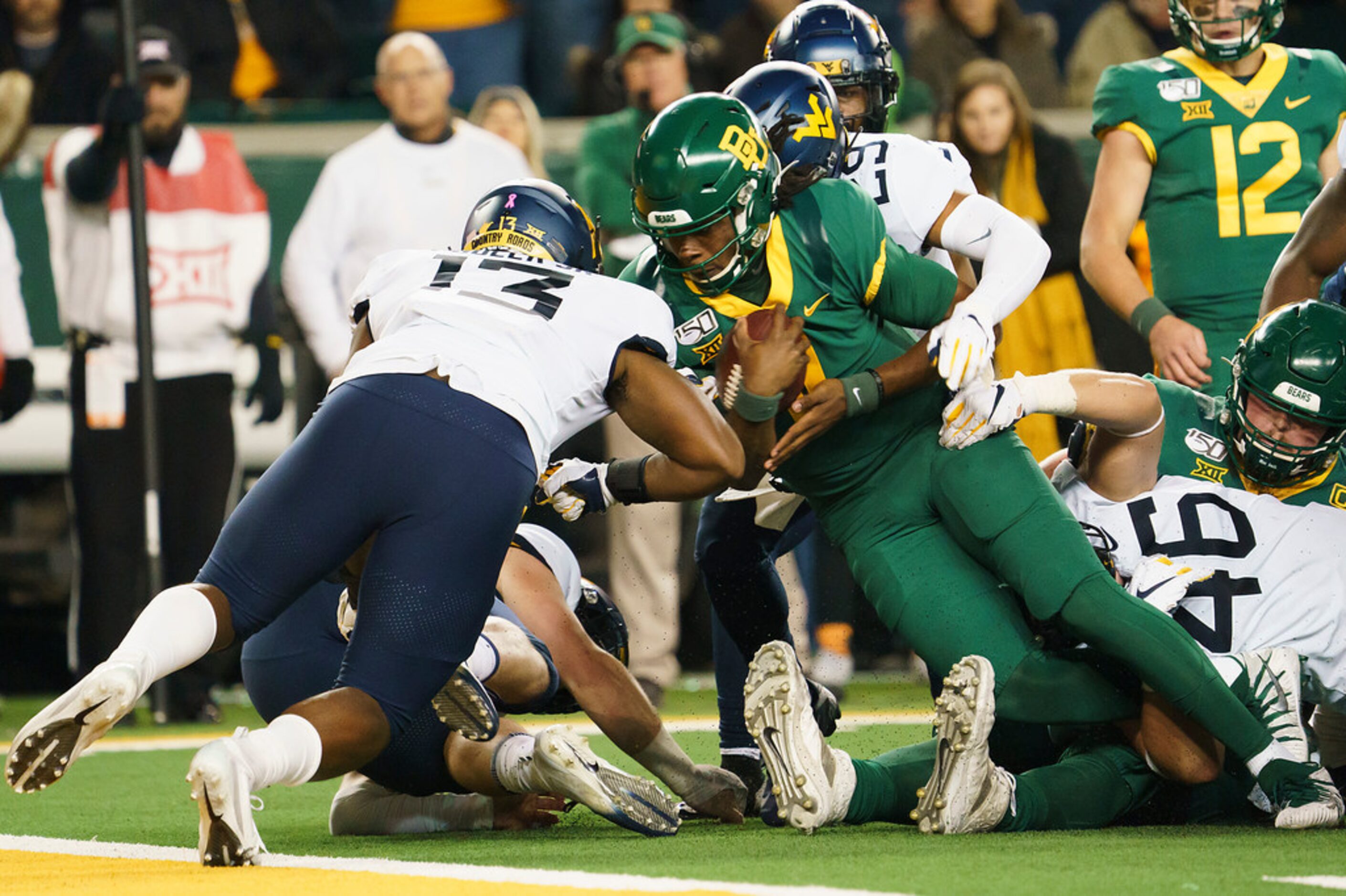 Baylor running back JaMycal Hasty (6) is stopped short of the end zone by West Virginia...