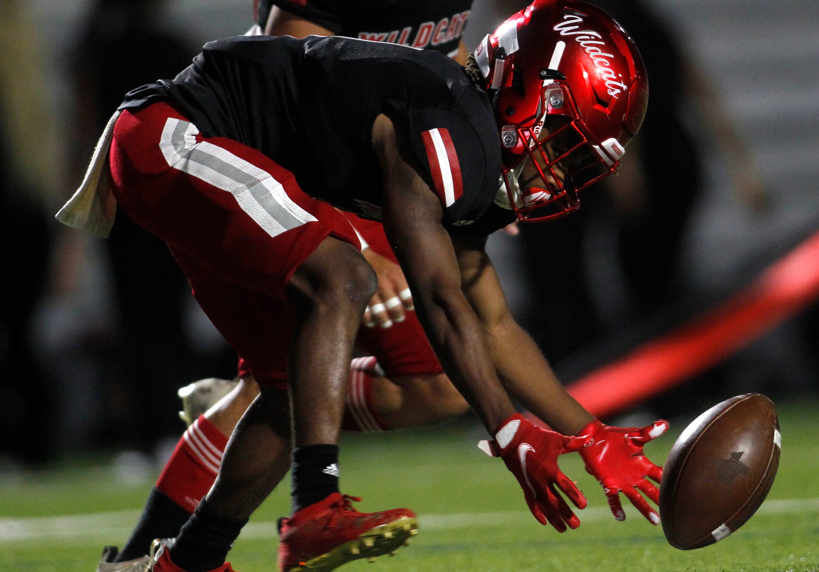 Dallas Woodrow Wilson receiver Deldrick Smith (1) reaches to recover a fumbled kickoff...