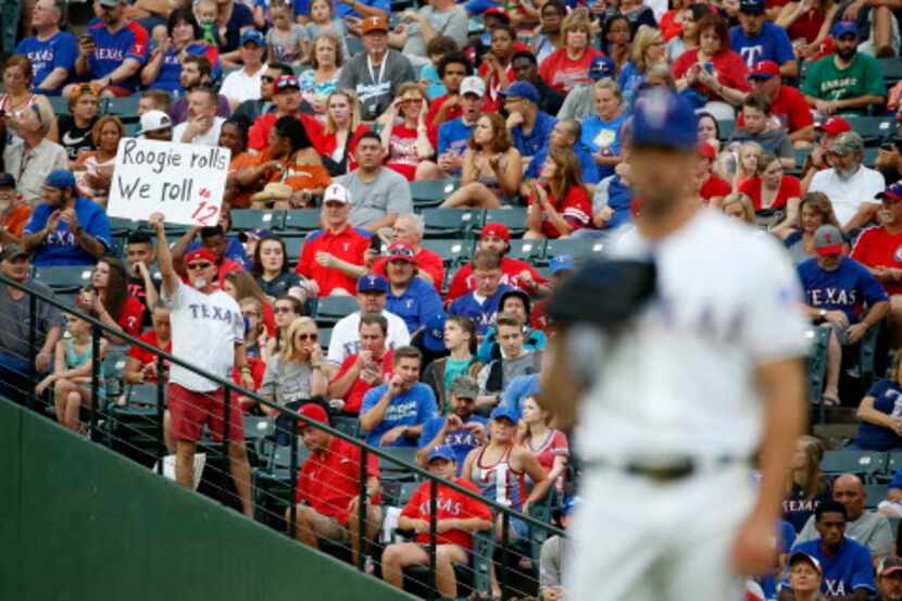 A fan holds up a sign supporting Rougned Odor during a recent game between the Texas Rangers...