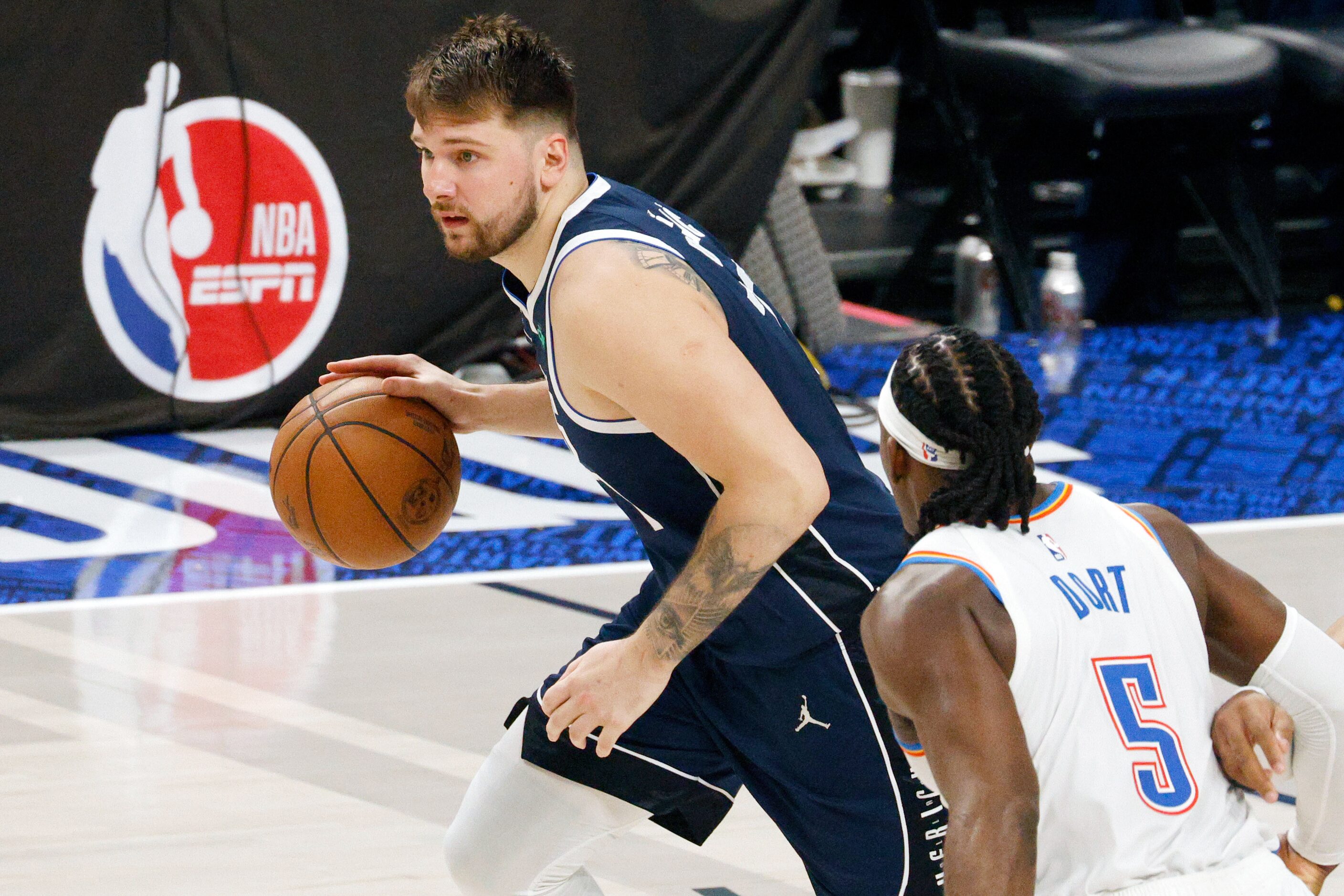 Dallas Mavericks guard Luka Doncic (77) drives past Oklahoma City Thunder guard Luguentz...