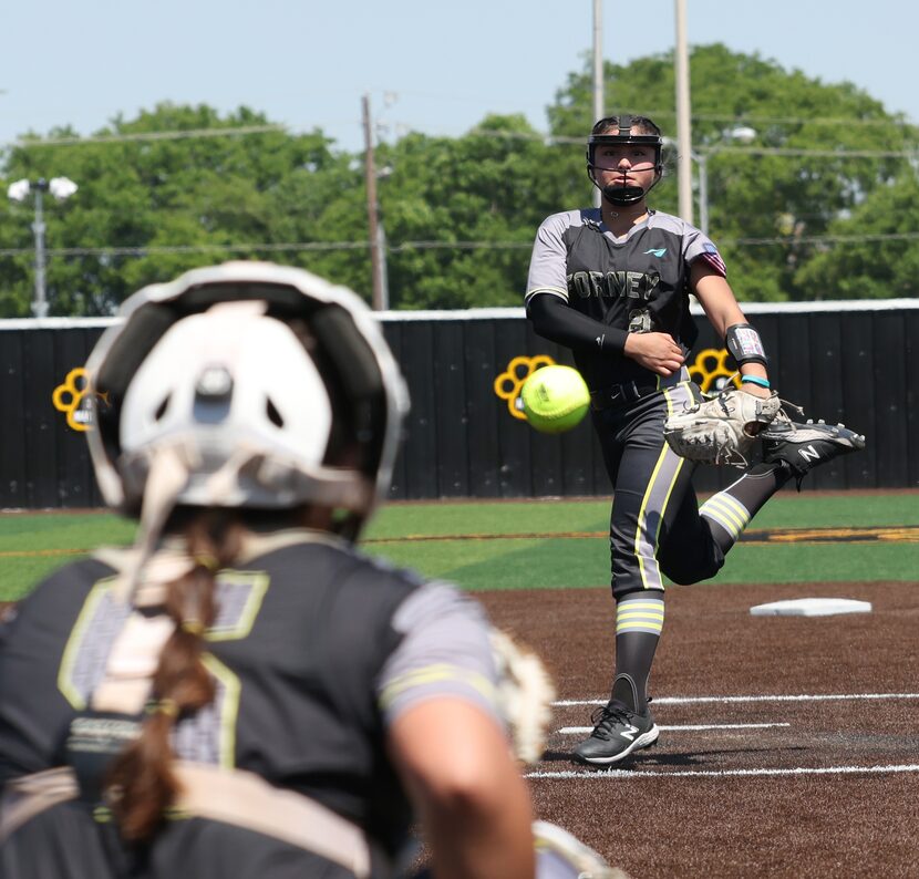 Forney pitcher Emmie Santos (21) delivers a pitch to a Prosper Walnut Grove batter during...