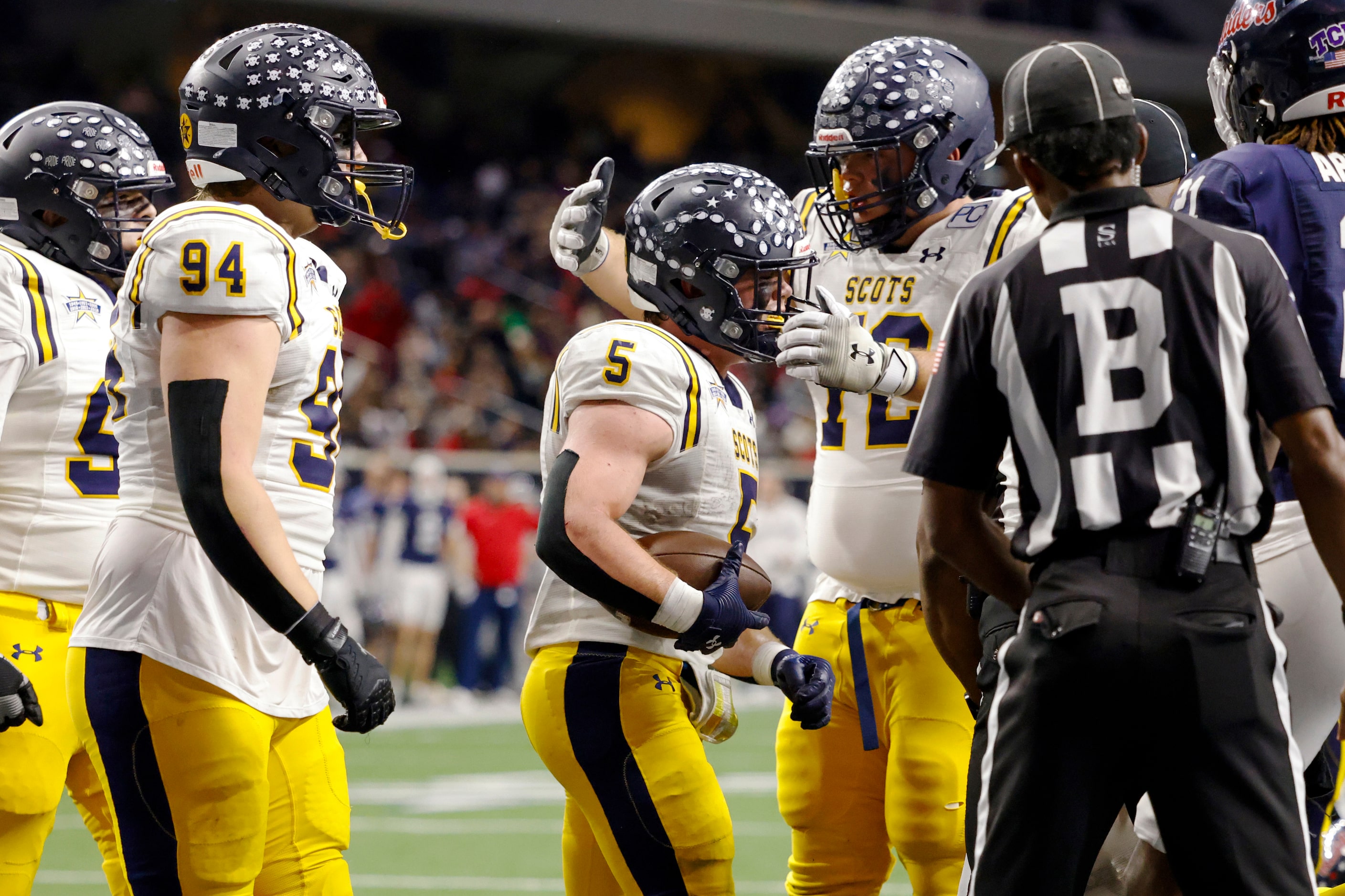 Highland Park running back James Lancaster (5) celebrates his rushing touchdown with...