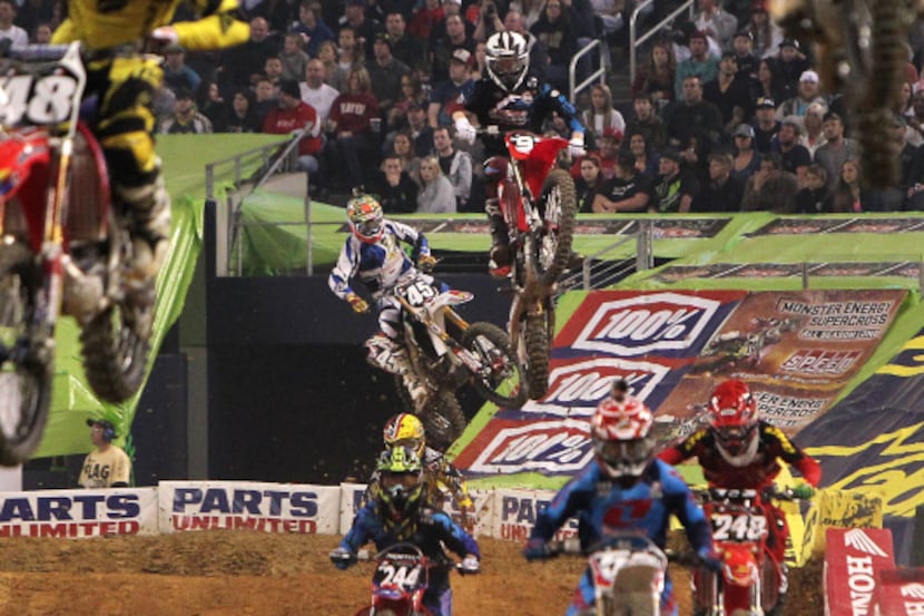 Racers in the opening heat of the SX Lites group compete in the Monster Energy AMA...