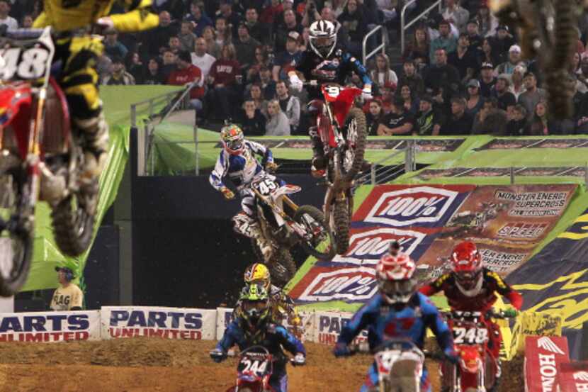 Racers in the opening heat of the SX Lites group compete in the Monster Energy AMA...