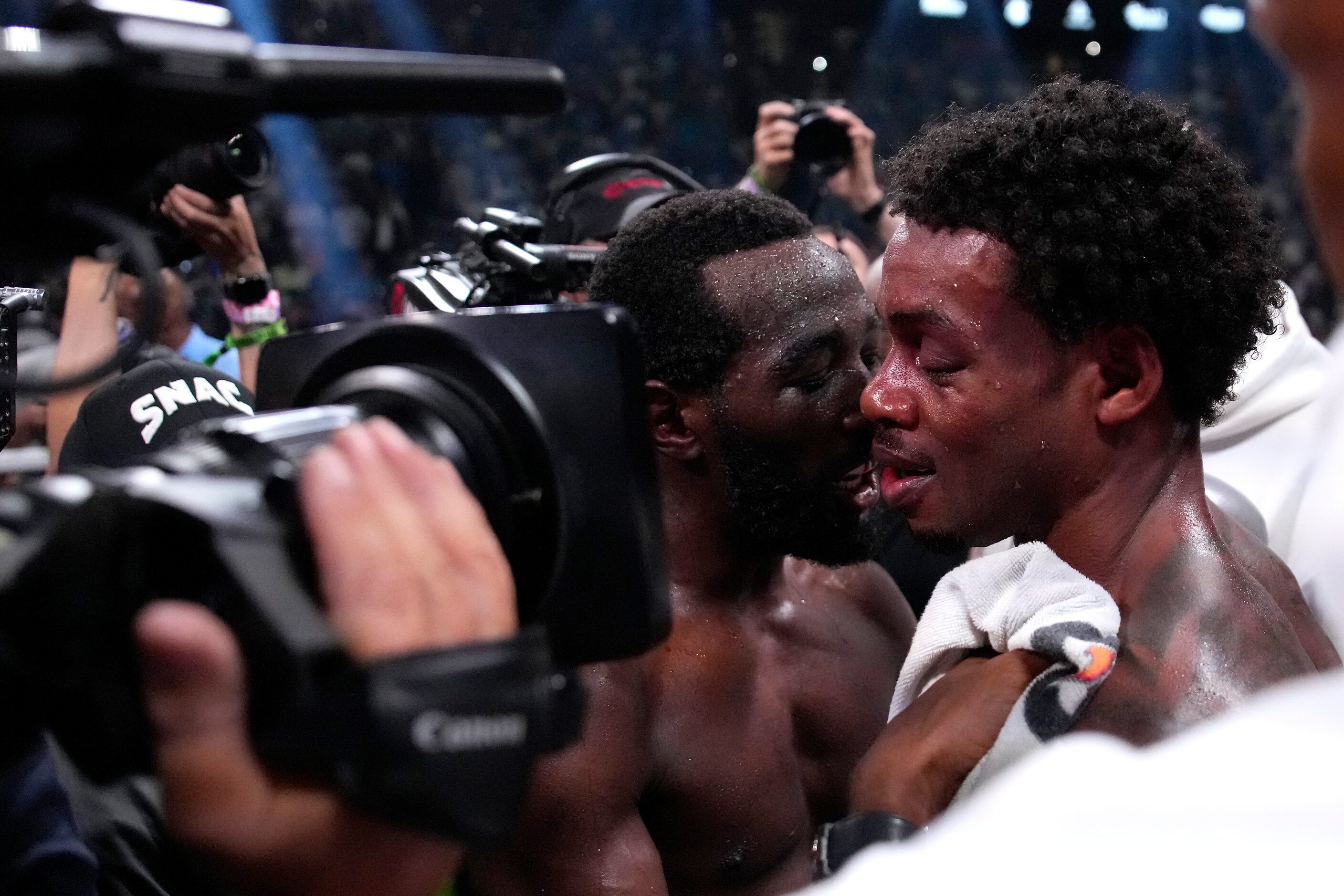 Terence Crawford, left, talks with Errol Spence Jr. fight after Crawford won their...