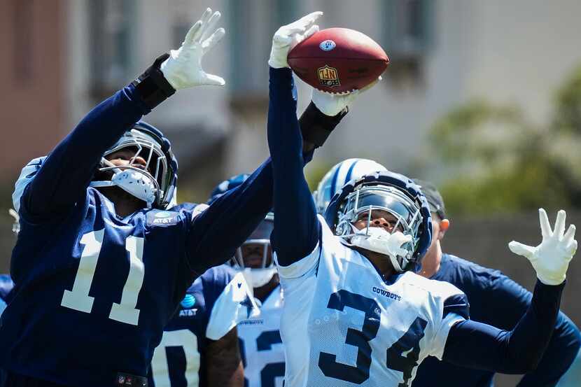 Dallas Cowboys linebacker Micah Parsons (11) reaches for a ball against running back Malik...