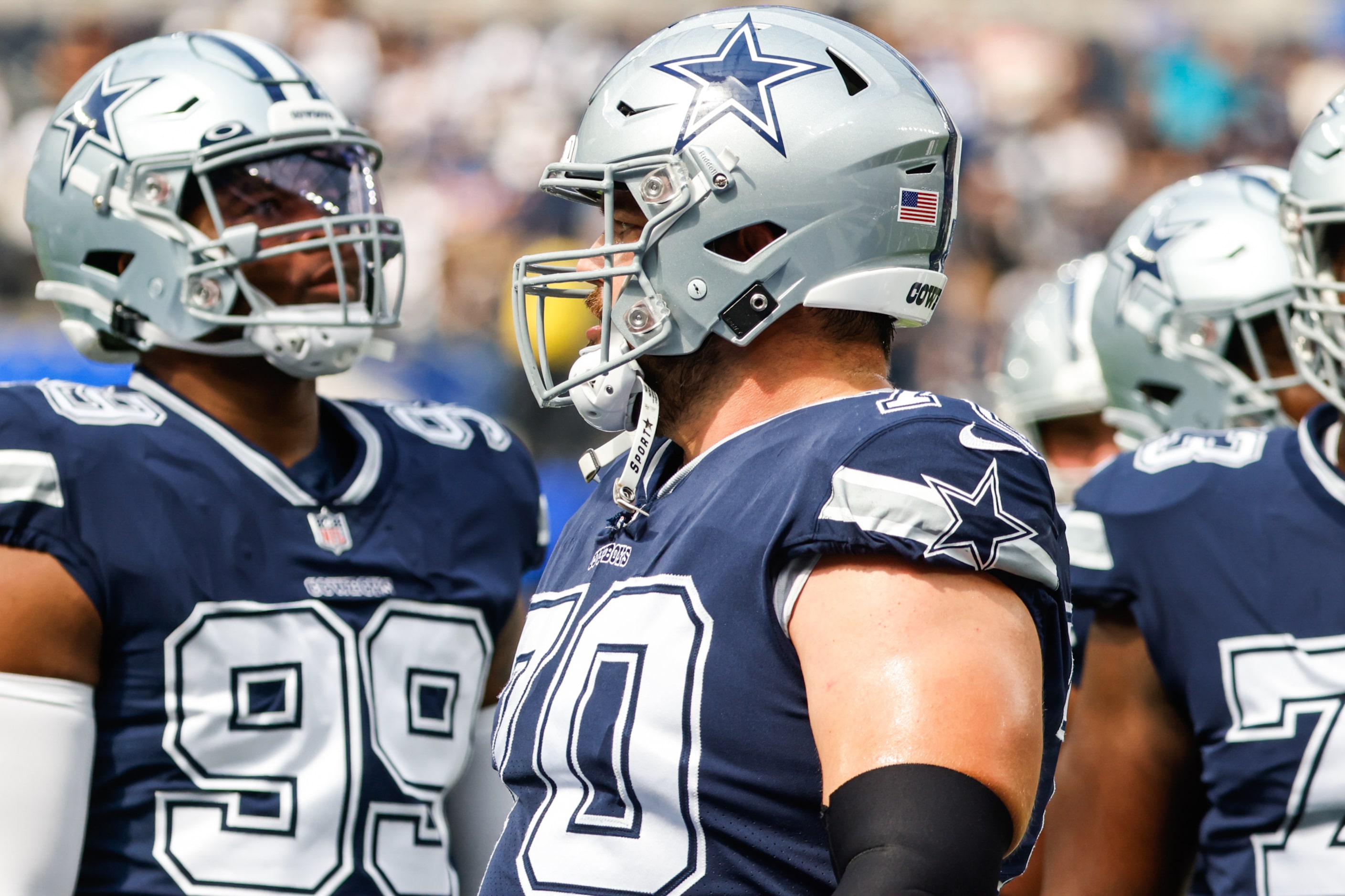 Dallas Cowboys defensive end Chauncey Golston (99) and guard Zack Martin (70) during warmup...